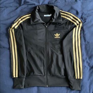Adidas track jacket. Black and gold.